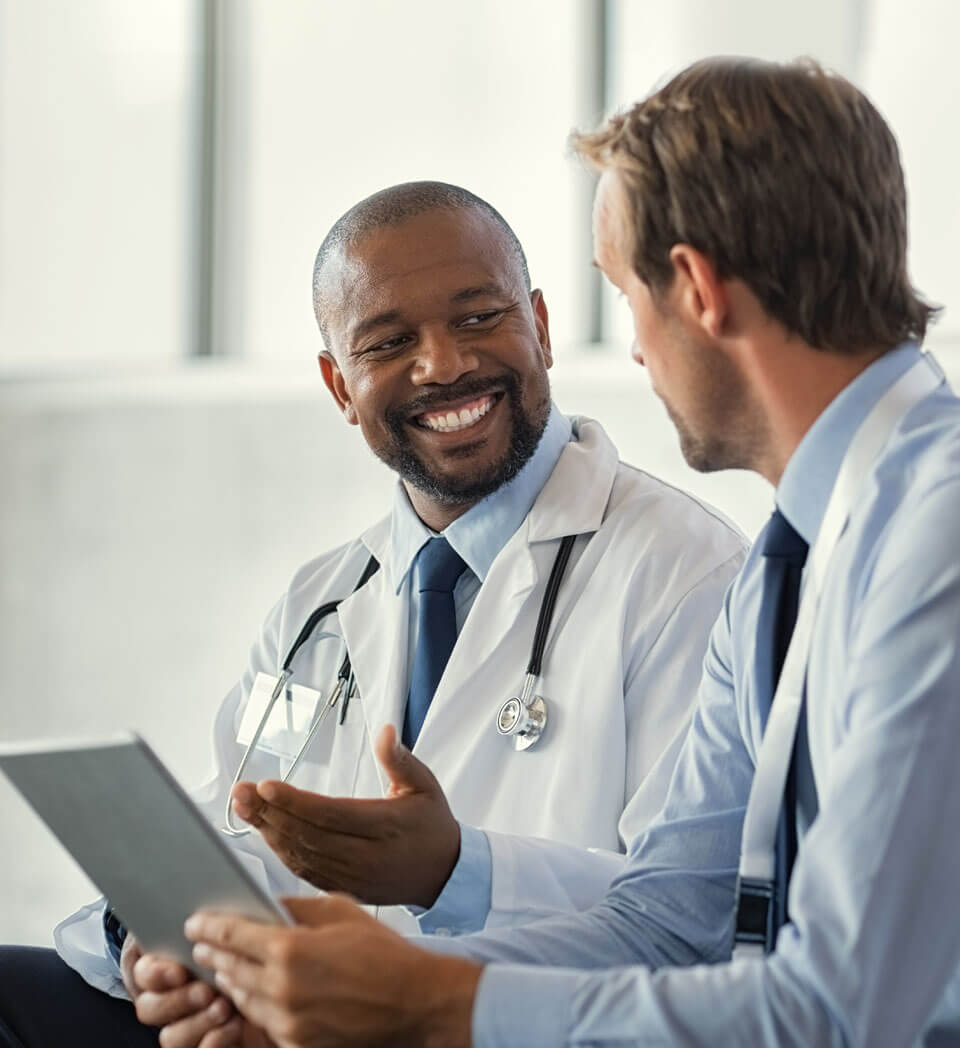 A transplant account manager uses an iPad to detail to a physician